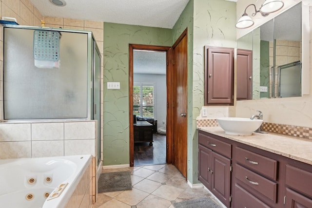 3801 Silver Maple Dr, Carrollton, TX 75007 - full bath with a textured ceiling, a stall shower, vanity, a whirlpool tub, and tile patterned floors