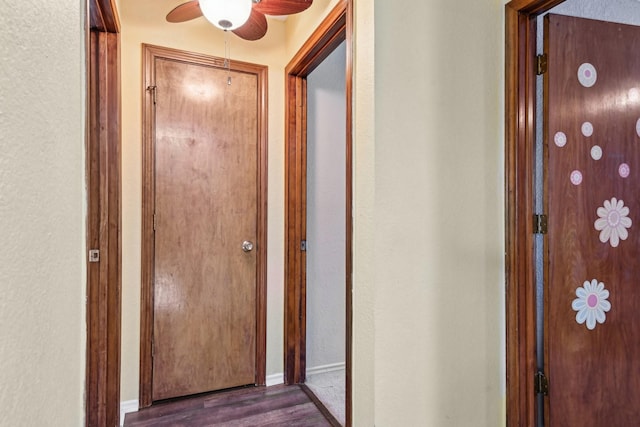 3801 Silver Maple Dr, Carrollton, TX 75007 - hallway featuring dark wood-style flooring, baseboards, and a textured wall