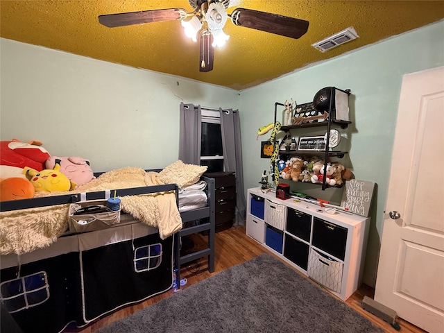 11717 Crumpton Dr, Balch Springs, TX 75180 - bedroom featuring wood finished floors and a ceiling fan