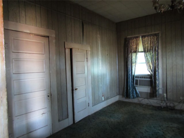507 N Beaton St, Corsicana, TX 75110 - unfurnished bedroom with wood walls and carpet flooring