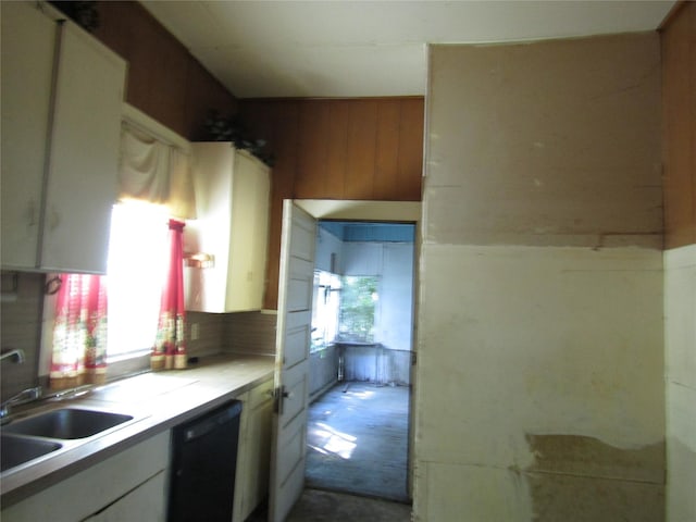507 N Beaton St, Corsicana, TX 75110 - kitchen featuring dishwasher, a sink, white cabinetry, light countertops, and tasteful backsplash