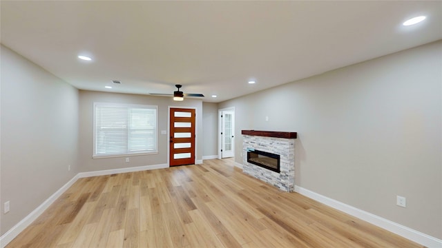 2210 Mcclure St, Irving, TX 75062 - unfurnished living room with light wood-style flooring, recessed lighting, a fireplace, baseboards, and ceiling fan