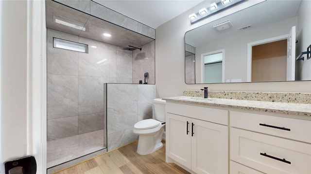 2210 Mcclure St, Irving, TX 75062 - full bath featuring toilet, wood finished floors, vanity, and walk in shower
