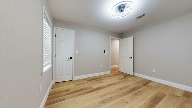 2210 Mcclure St, Irving, TX 75062 - unfurnished bedroom with light wood finished floors and baseboards