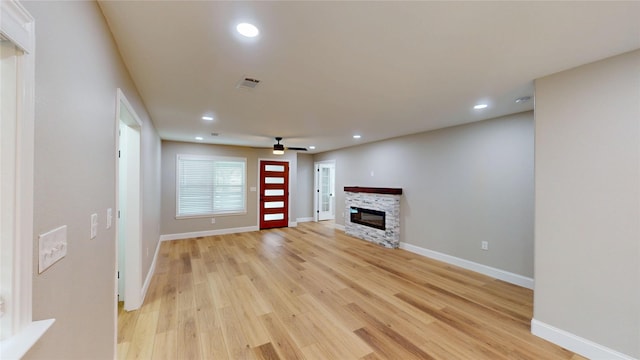 2210 Mcclure St, Irving, TX 75062 - unfurnished living room with a fireplace, light wood-style floors, a ceiling fan, recessed lighting, and baseboards