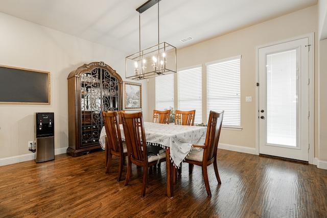 817 Calm Crest Dr, Rockwall, TX 75087 - dining space featuring dark wood-style flooring and a chandelier