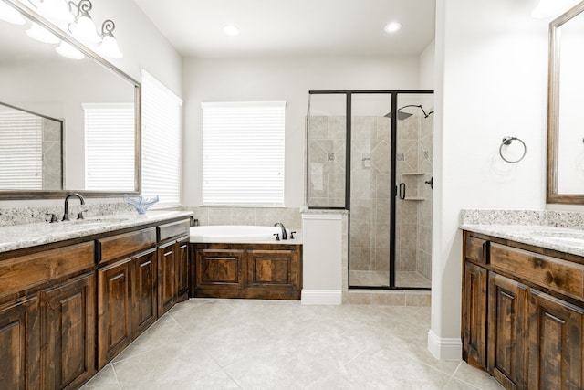 817 Calm Crest Dr, Rockwall, TX 75087 - full bathroom with two vanities, a stall shower, tile patterned floors, a bath, and recessed lighting