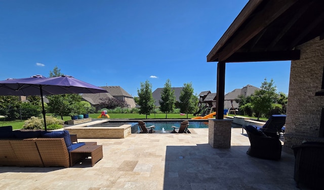 817 Calm Crest Dr, Rockwall, TX 75087 - view of swimming pool with a patio, a playground, and a pool with connected hot tub