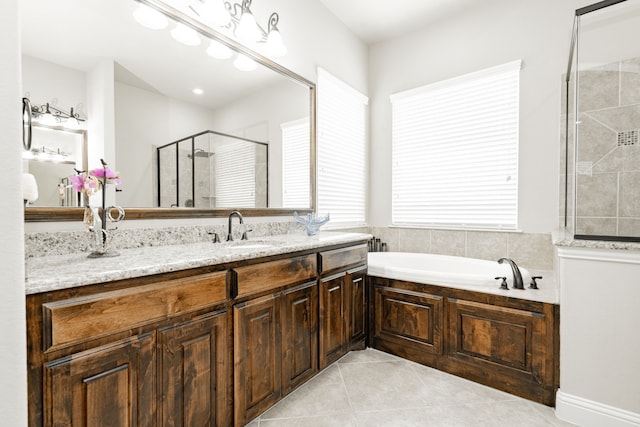 817 Calm Crest Dr, Rockwall, TX 75087 - bathroom featuring tile patterned floors, a shower stall, a garden tub, and vanity
