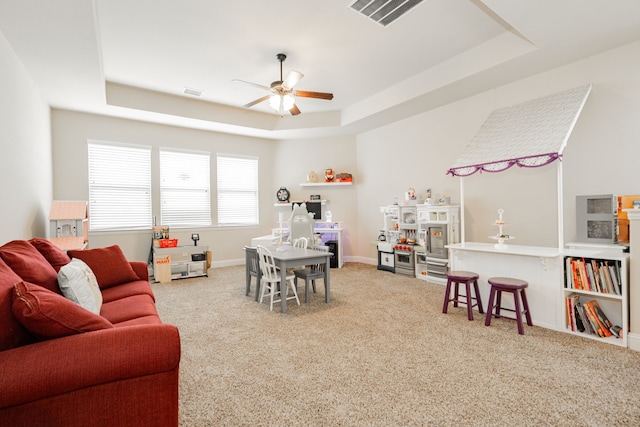 817 Calm Crest Dr, Rockwall, TX 75087 - recreation room with a tray ceiling, carpet, and a ceiling fan