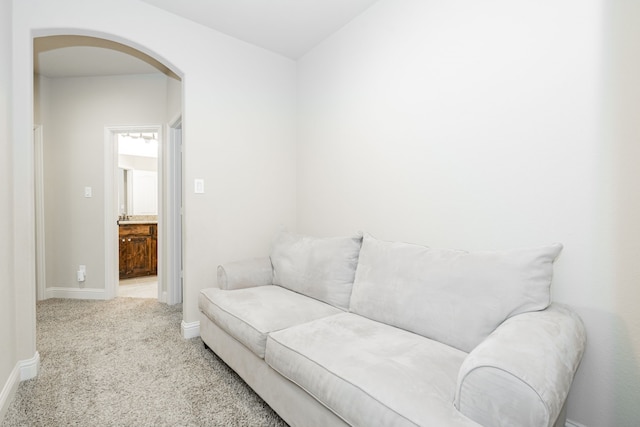 817 Calm Crest Dr, Rockwall, TX 75087 - carpeted living area with arched walkways and baseboards