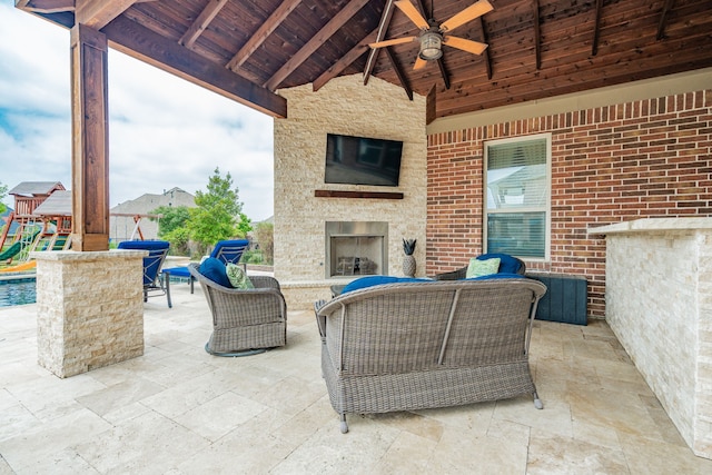 817 Calm Crest Dr, Rockwall, TX 75087 - view of patio featuring a ceiling fan and an outdoor living space with a fireplace