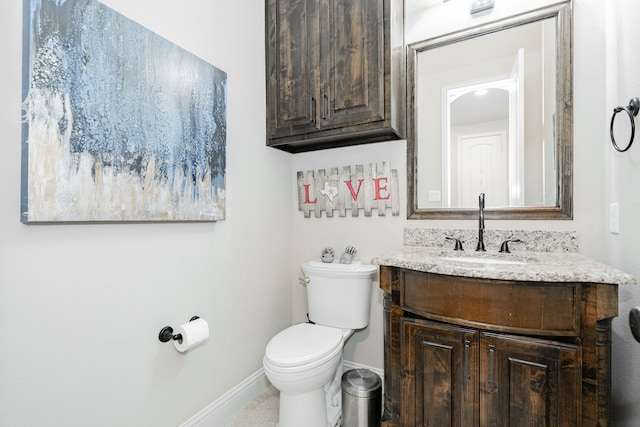 817 Calm Crest Dr, Rockwall, TX 75087 - half bathroom featuring vanity, toilet, and baseboards