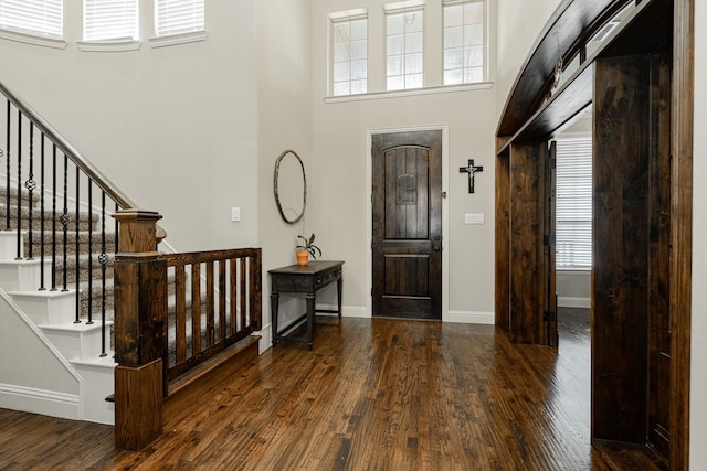 817 Calm Crest Dr, Rockwall, TX 75087 - foyer entrance featuring wood finished floors, a high ceiling, and stairway
