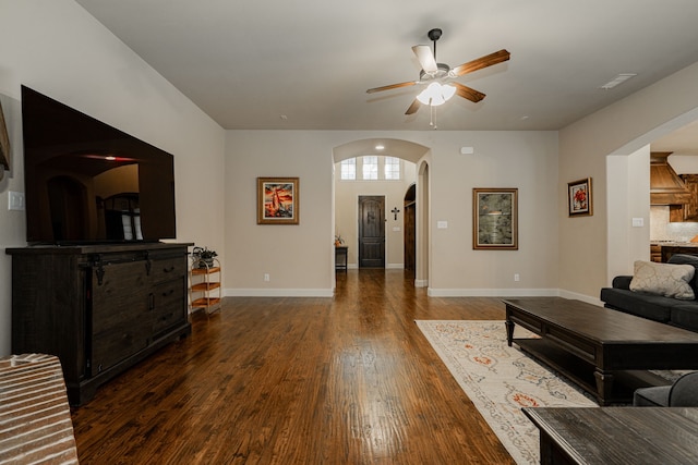 817 Calm Crest Dr, Rockwall, TX 75087 - living room with arched walkways, a ceiling fan, and wood finished floors