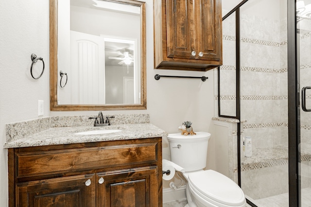 817 Calm Crest Dr, Rockwall, TX 75087 - bathroom with toilet, vanity, a shower stall, and ceiling fan