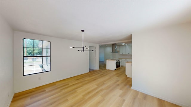3809 Grover Ave, Fort Worth, TX 76106 - unfurnished living room with light wood-style floors and baseboards