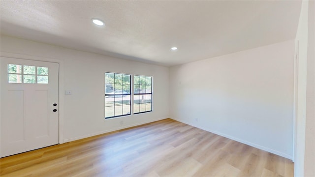 3809 Grover Ave, Fort Worth, TX 76106 - entrance foyer featuring healthy amount of natural light, light wood-style floors, recessed lighting, baseboards, and a textured ceiling