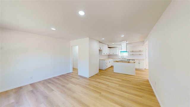 3809 Grover Ave, Fort Worth, TX 76106 - unfurnished living room with recessed lighting, light wood-style flooring, baseboards, and a sink