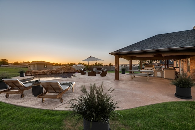 10260 E Rancho Diego Ln, Crowley, TX 76036 - patio terrace at dusk with area for grilling, a patio area, and a gazebo
