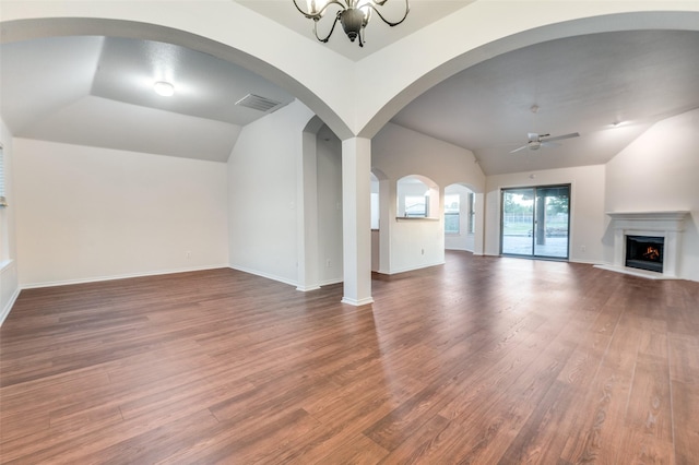 10260 E Rancho Diego Ln, Crowley, TX 76036 - unfurnished living room with lofted ceiling, a ceiling fan, wood finished floors, a lit fireplace, and a chandelier