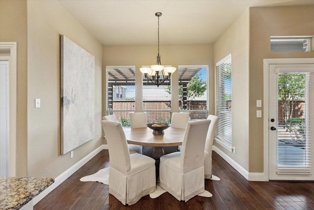 13929 Castlegate Dr, Frisco, TX 75035 - dining area featuring a chandelier, dark wood-style floors, and baseboards