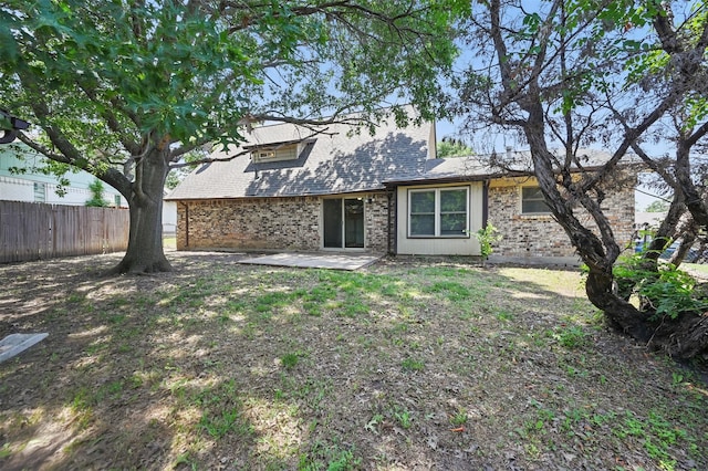 2913 Portales Dr, Fort Worth, TX 76116 - rear view of property featuring a patio, brick siding, and roof with shingles