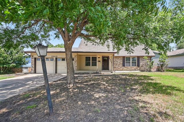 2913 Portales Dr, Fort Worth, TX 76116 - view of front of home featuring a garage, concrete driveway, a shingled roof, and brick siding