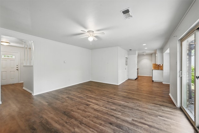 2913 Portales Dr, Fort Worth, TX 76116 - unfurnished living room featuring dark wood-style flooring, ceiling fan, baseboards, and recessed lighting