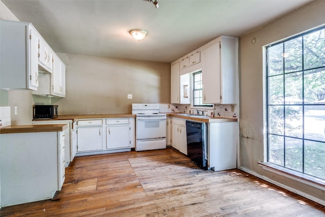 711 W State St, Terrell, TX 75160 - kitchen featuring electric stove, black dishwasher, a sink, and light wood-style floors