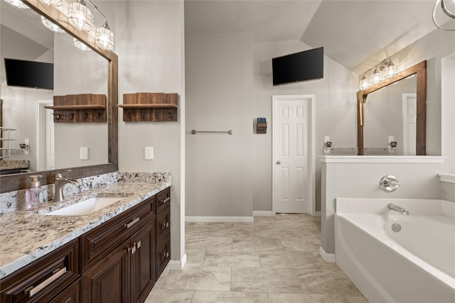 1000 Macadamia St, Venus, TX 76084 - full bathroom with vaulted ceiling, a bath, vanity, and baseboards