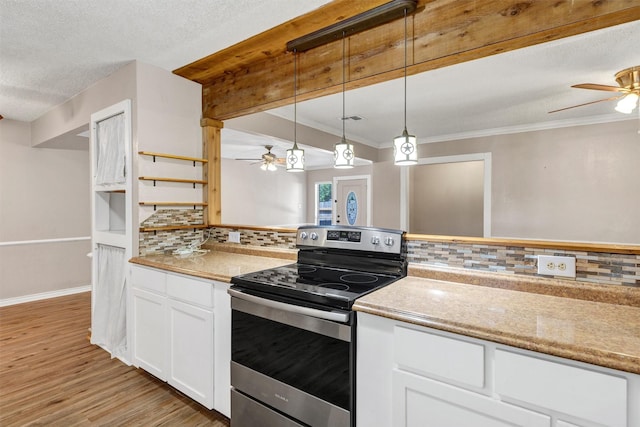 616 Bellevue Dr, Cleburne, TX 76033 - kitchen with electric stove, a ceiling fan, light wood-style floors, decorative backsplash, and a textured ceiling