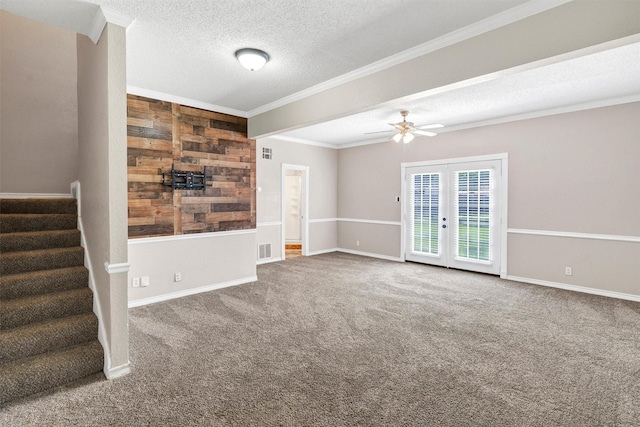 616 Bellevue Dr, Cleburne, TX 76033 - carpeted spare room with french doors, stairway, ceiling fan, a textured ceiling, and crown molding