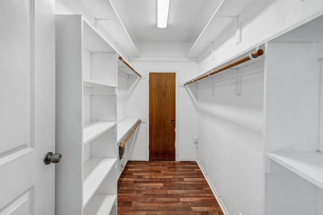 616 Bellevue Dr, Cleburne, TX 76033 - spacious closet featuring dark wood finished floors