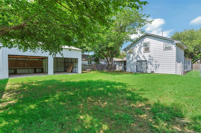 616 Bellevue Dr, Cleburne, TX 76033 - view of yard featuring an outbuilding and an outdoor structure