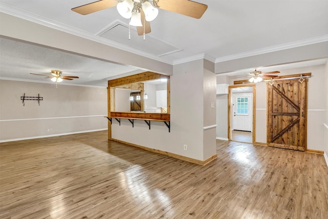616 Bellevue Dr, Cleburne, TX 76033 - unfurnished living room with a ceiling fan, attic access, light wood finished floors, and ornamental molding