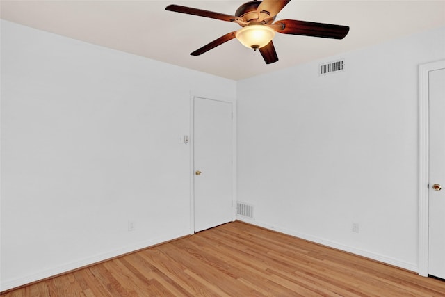 10533 Solta Dr, Dallas, TX 75218 - unfurnished room featuring light wood-style floors, ceiling fan, and baseboards