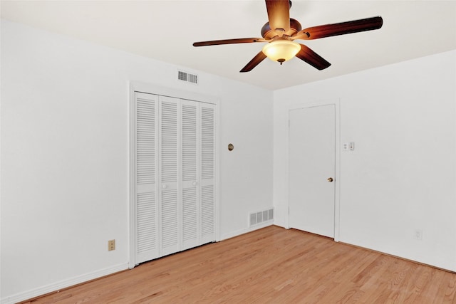 10533 Solta Dr, Dallas, TX 75218 - unfurnished bedroom with light wood finished floors, ceiling fan, and a closet