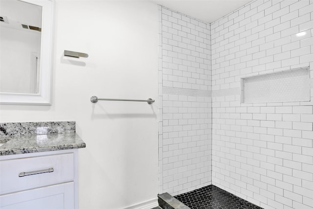 10533 Solta Dr, Dallas, TX 75218 - full bathroom with a tile shower and vanity