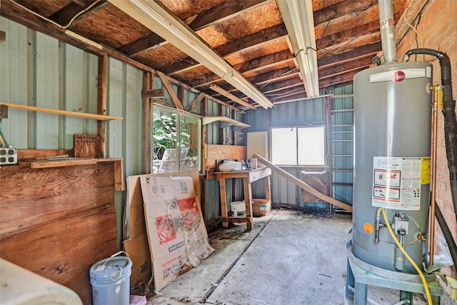 10533 Solta Dr, Dallas, TX 75218 - misc room featuring water heater and concrete floors