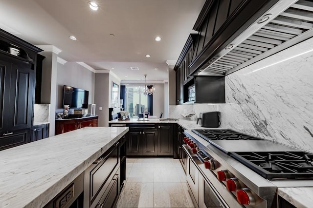 2525 N Pearl St Unit 1704, Dallas, TX 75201 - kitchen with ornamental molding, recessed lighting, extractor fan, tasteful backsplash, and high end range