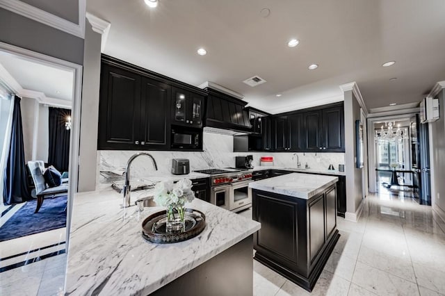 2525 N Pearl St Unit 1704, Dallas, TX 75201 - kitchen featuring dark cabinetry, range with two ovens, crown molding, black microwave, and recessed lighting