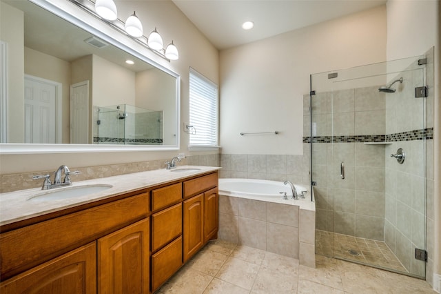 3608 Walden Dr, Mckinney, TX 75071 - bathroom featuring a stall shower, a garden tub, tile patterned floors, and double vanity