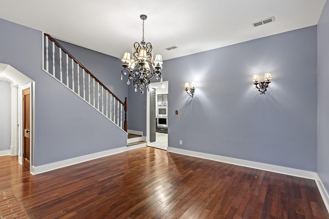715 S Barnett Ave, Dallas, TX 75211 - unfurnished living room with a chandelier, hardwood / wood-style flooring, stairway, and baseboards