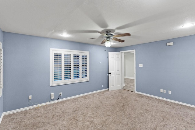 715 S Barnett Ave, Dallas, TX 75211 - unfurnished bedroom featuring carpet, baseboards, and a ceiling fan