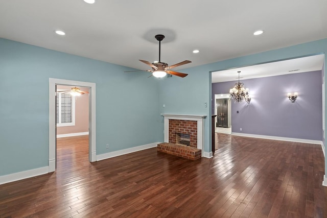 715 S Barnett Ave, Dallas, TX 75211 - unfurnished living room with ceiling fan, a fireplace, hardwood / wood-style floors, a chandelier, and baseboards