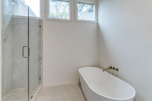 5865 Farquhar Ln, Dallas, TX 75209 - full bath with a freestanding bath, a shower stall, and tile patterned flooring