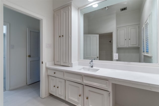 5865 Farquhar Ln, Dallas, TX 75209 - bathroom with vanity, a shower, and baseboards