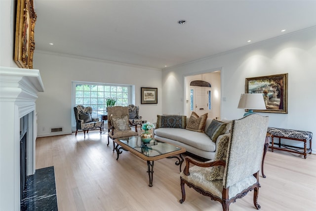 5865 Farquhar Ln, Dallas, TX 75209 - living area featuring a fireplace, wood finished floors, and crown molding