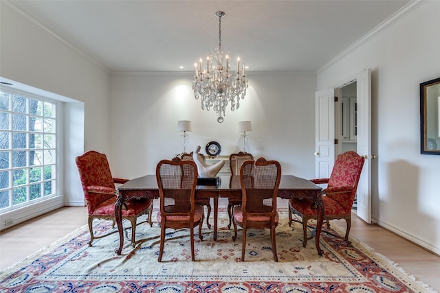 5865 Farquhar Ln, Dallas, TX 75209 - dining area featuring a chandelier, light wood finished floors, crown molding, and baseboards